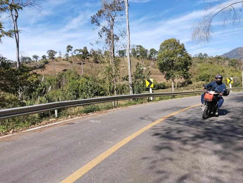 I had only one picture taken while riding my motorbike, captured by three friends from Laplae, Uttaradit. Despite meeting for the first time, their kindness was greatly appreciated.