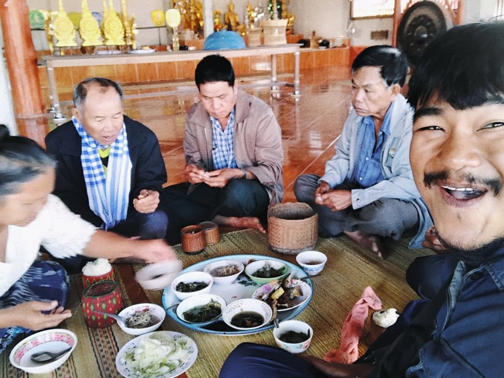 Visiting a old temple in Xayabouly, Laos, with local people who invited me to eat together during a trip on a Buddhist holy day.