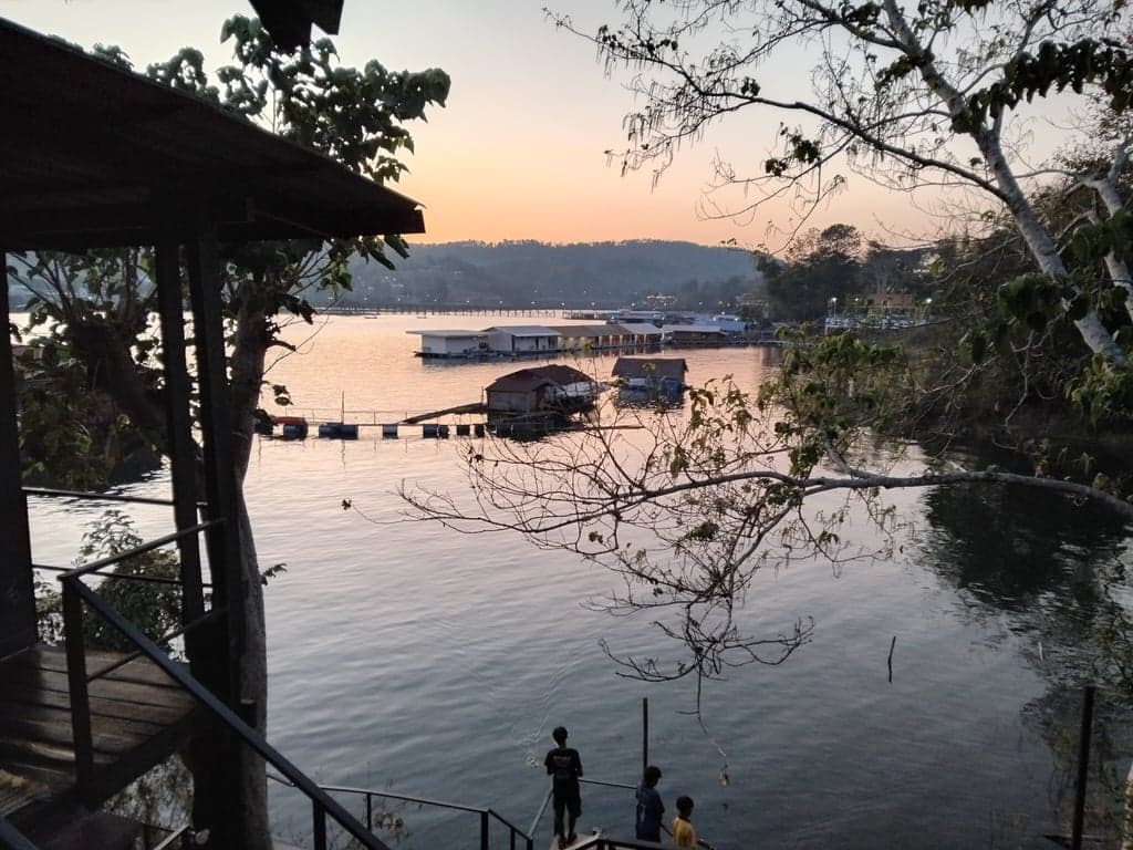 The longest wooden bridge in Thailand, the Mon Bridge, stretching over the Songkaria River in Sangkhlaburi, Kanchanaburi.